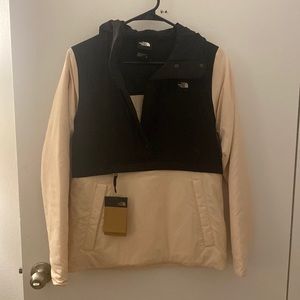 Selling a North Face XS jacket — color light pink/cream. Never been worn!